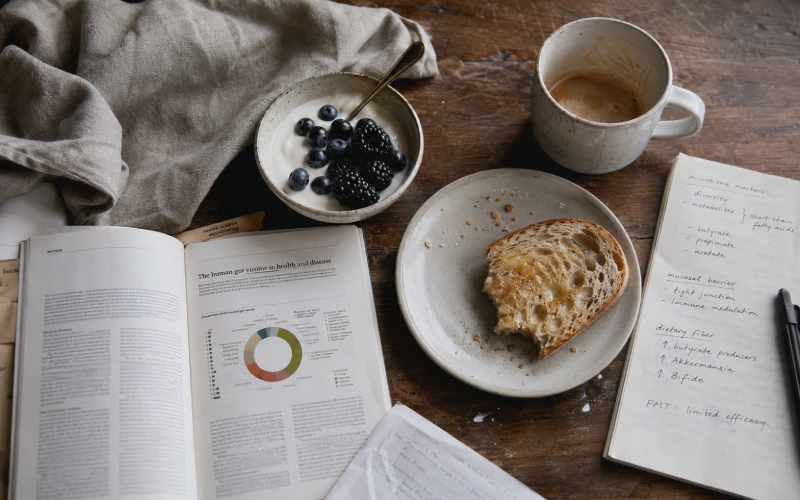 Breakfast table beside notes on gut health research