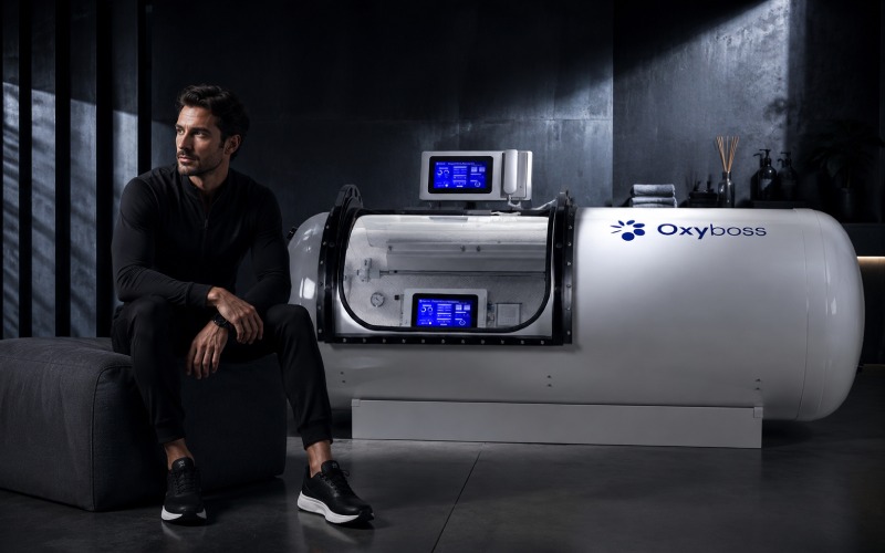 Man beside a luxury recovery chamber