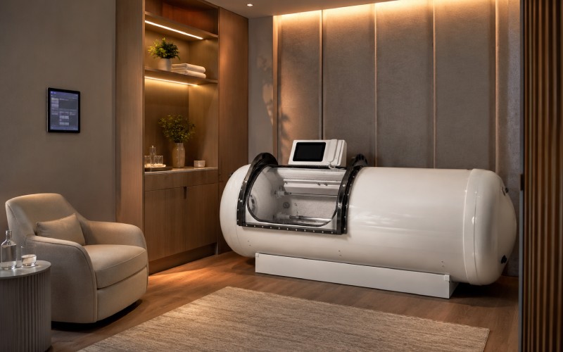 Private monoplace hard shell chamber suite designed for premium one-on-one wellness appointments