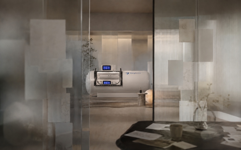 Soft hyperbaric chamber seen through clearing glass reflections