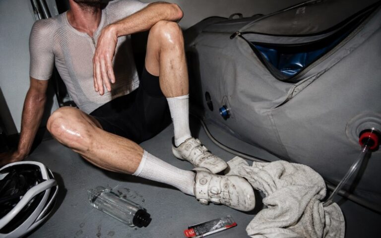 Cyclist resting after training beside a chamber