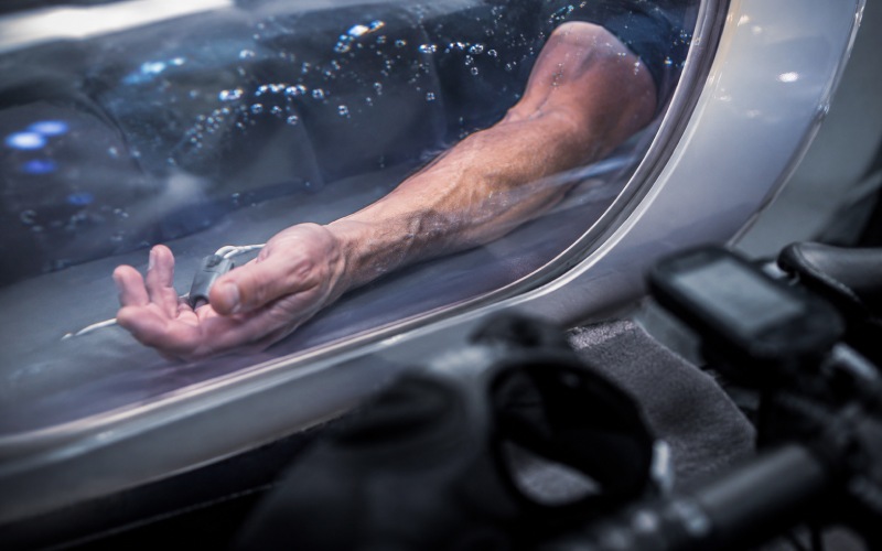 Cyclist’s arm inside a pressurized chamber