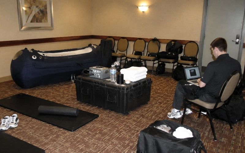 Portable hyperbaric recovery station in an away-game hotel room